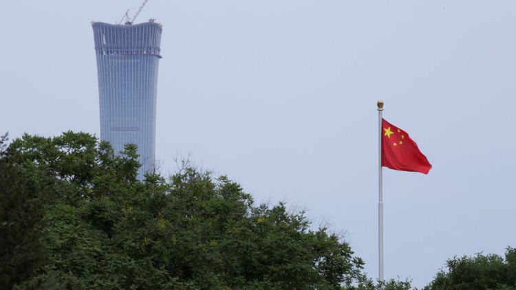 China denies "slanderous" economic espionage charges from U.S., allies