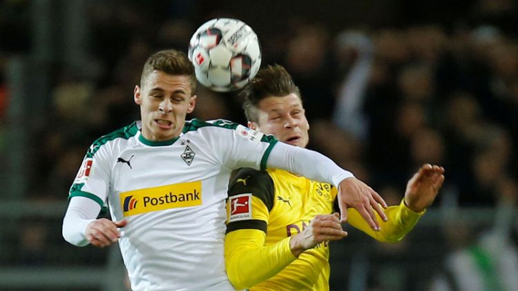 Dortmund beat Gladbach 2-1 to restore nine-point lead