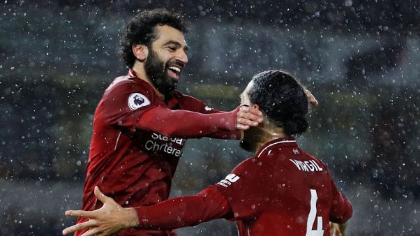 Liverpool seal Christmas top spot as Salah and Van Dijk sink Wolves Liverpool seal Christmas top spot as Salah and Van Dijk sink Wolves