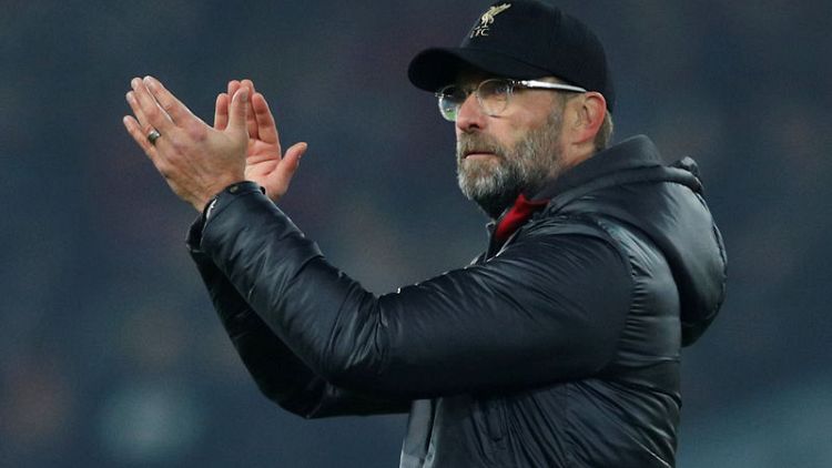 Klopp plays down six-point lead for title-chasing Reds