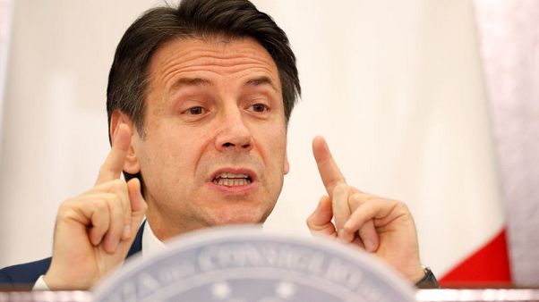 Italy PM defends budget as tempers fray in parliament Italy PM defends budget as tempers fray in parliament