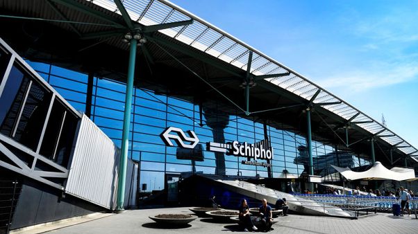 Man held at Amsterdam airport after bomb threat, departure hall reopens Man held at Amsterdam airport after bomb threat, departure hall reopens