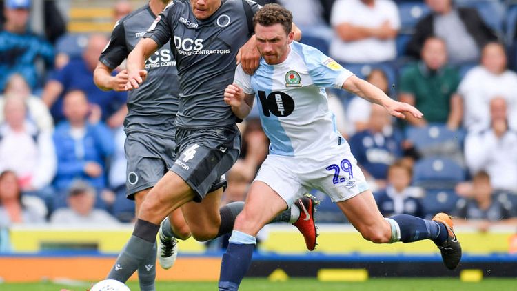 Millwall's Hutchinson suffers cut while clearing trash at home