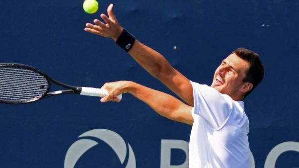 Trick-shot Tomic bamboozles Kyrgios with bizarre match point serve Trick-shot Tomic bamboozles Kyrgios with bizarre match point serve