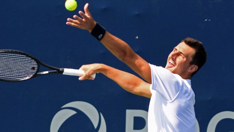 Trick-shot Tomic bamboozles Kyrgios with bizarre match point serve