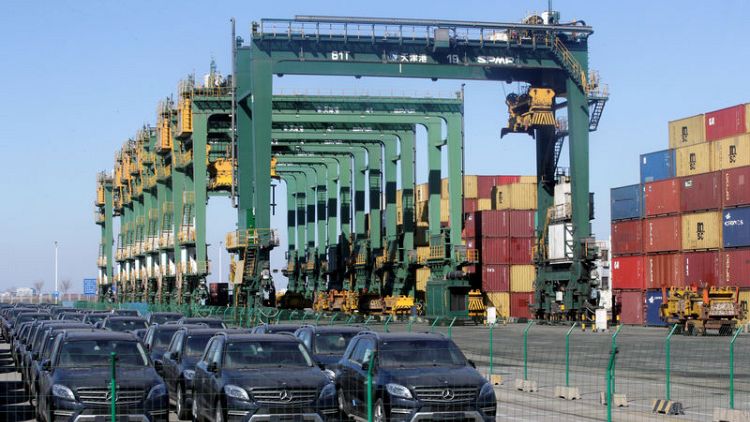 At China port, tariff drop a salve for hard-hit traders of American cars