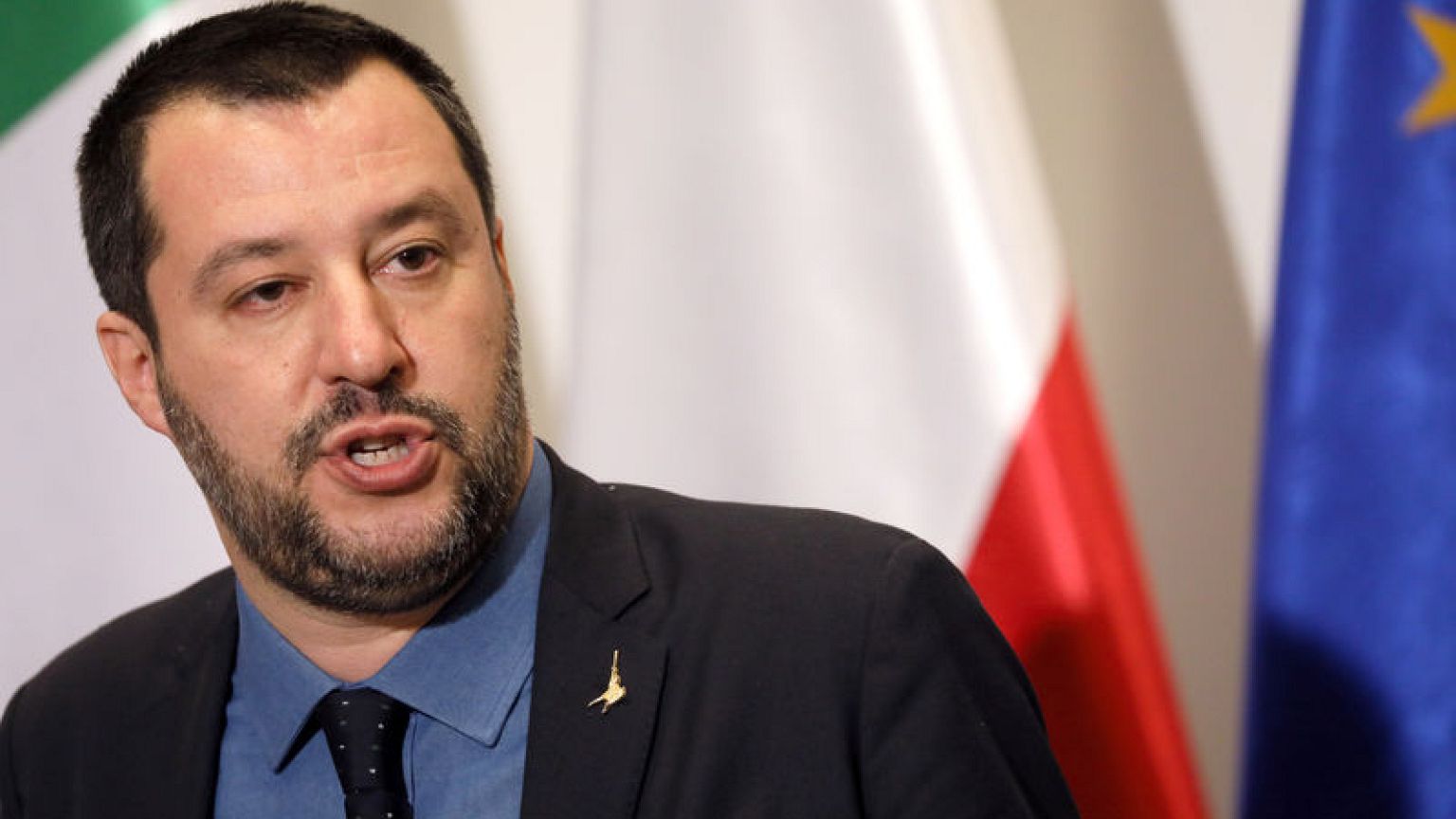 Italy coalition parties resolve migrant spat in late-night talks