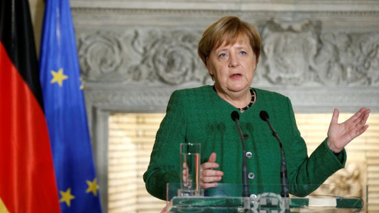 Merkel says Greece entering new era, reforms must continue
