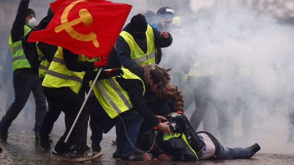 Yellow vest protests hit with police water cannon, tear gas in Paris Yellow vest protests hit with police water cannon, tear gas in Paris