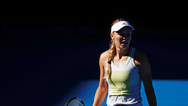 Tennis - Excited Wozniacki more careful of her body in title defence