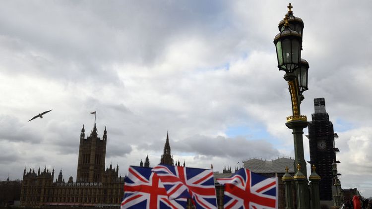 UK parliament to reject May's EU divorce deal, say economists
