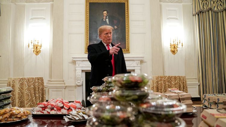Burgers by candlelight - Trump lays out fast food for college football champs