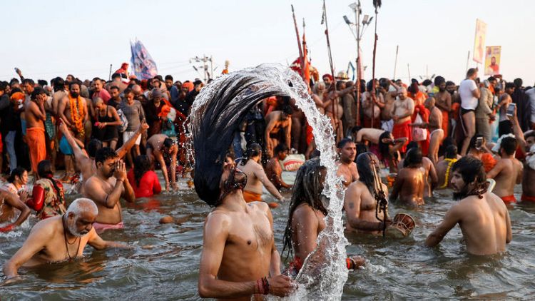 Hindu ascetics lead millions of Indians in holy bath