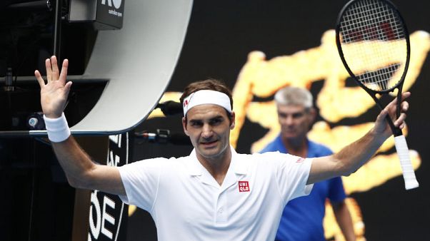Federer fends off British qualifier Evans to reach third round Federer fends off British qualifier Evans to reach third round