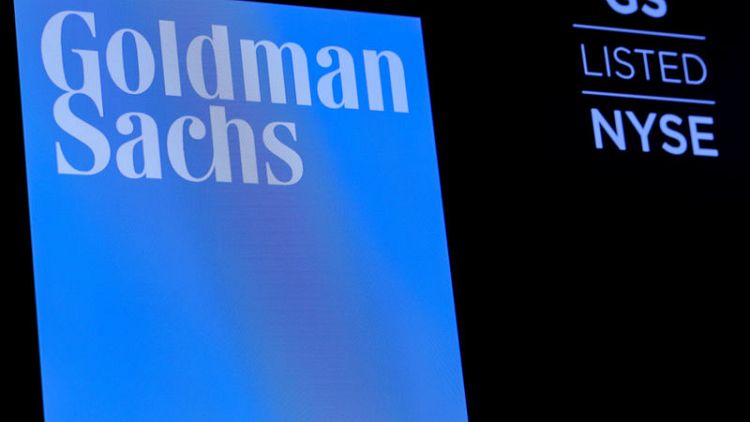 Goldman Sachs reports higher trading revenue, shares jump