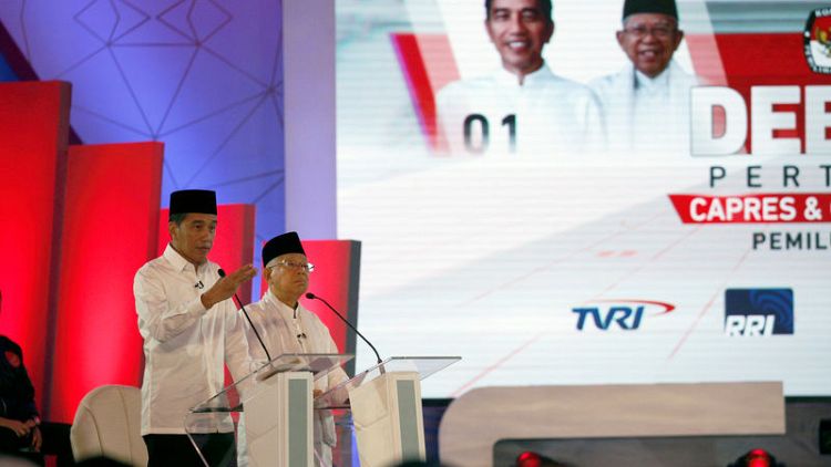 Indonesian presidential candidates spar over corruption, law in debate