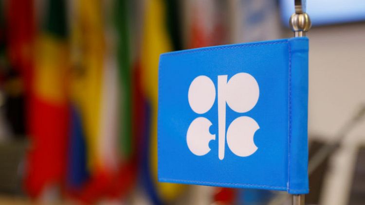 OPEC sees oil market not yet out of woods, tries to avoid new glut