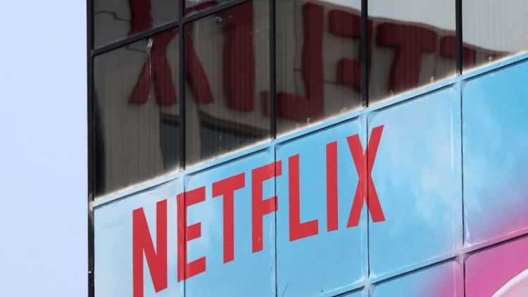 Netflix's fourth-quarter revenue misses estimates; shares slip