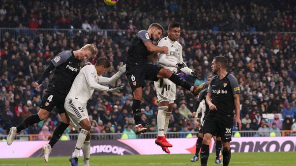 Madrid climb to third with vital win over Sevilla Madrid climb to third with vital win over Sevilla
