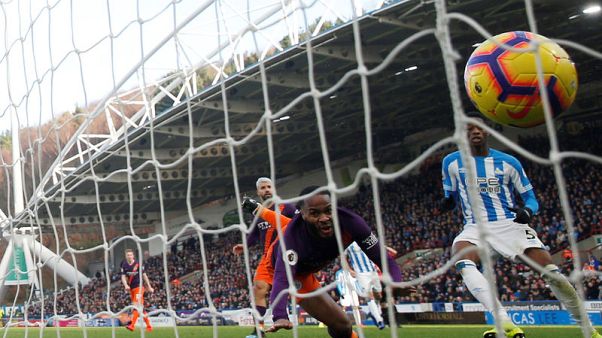 Manchester City ease past Huddersfield to close gap on Liverpool Manchester City ease past Huddersfield to close gap on Liverpool