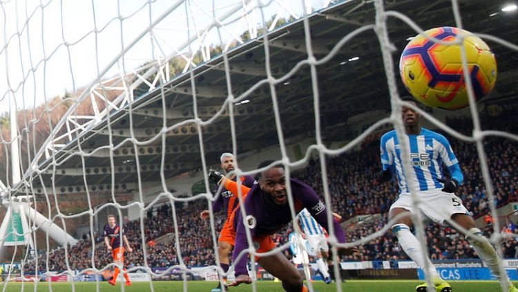 Manchester City ease past Huddersfield to close gap on Liverpool