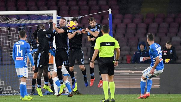 Napoli cling on for win over 10-man Lazio Napoli cling on for win over 10-man Lazio