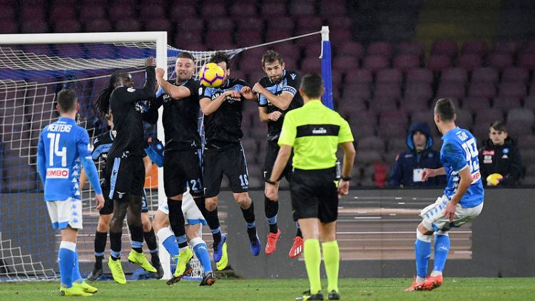 Napoli cling on for win over 10-man Lazio