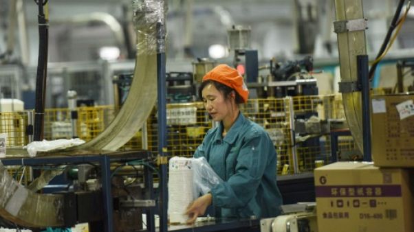 Une ouvrière dans une usine à Hangzhou le 21 janvier 2019 Une ouvrière dans une usine à Hangzhou le 21 janvier 2019