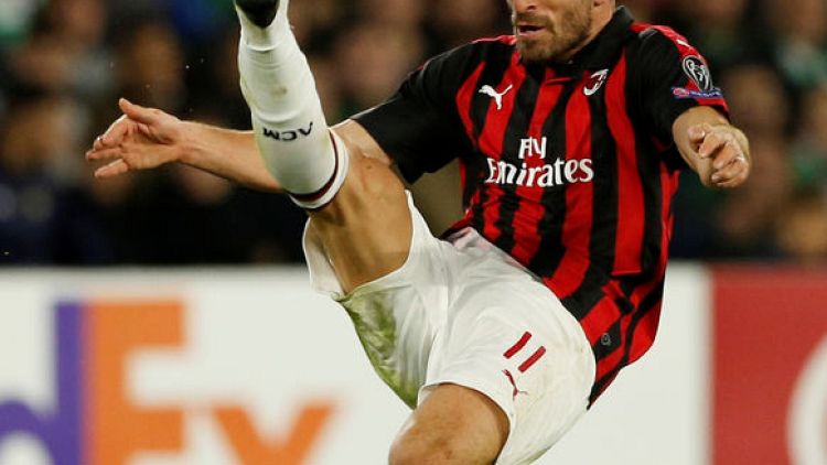 Soccer: Milan move into Champions League places with Genoa win