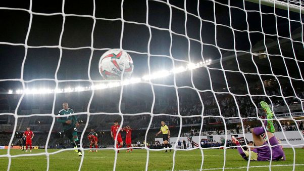 Hosts UAE reach Asian Cup last eight with extra-time penalty Hosts UAE reach Asian Cup last eight with extra-time penalty