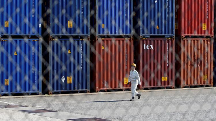 Japan exports post worst fall in two years as trade war bites