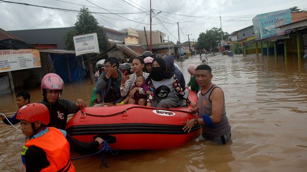 Overflowing dam kills at least 30 in Indonesia Overflowing dam kills at least 30 in Indonesia