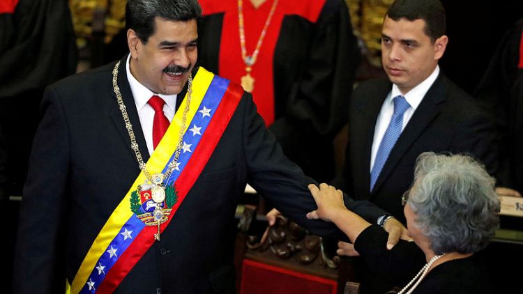 Exclusive: Kremlin-linked contractors help guard Venezuela's Maduro - sources