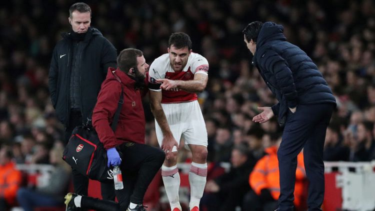 Arsenal's Sokratis out for a month with ankle problem