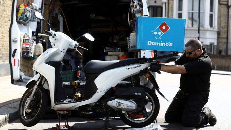 Domino's sees profit at lower end of range, shares down