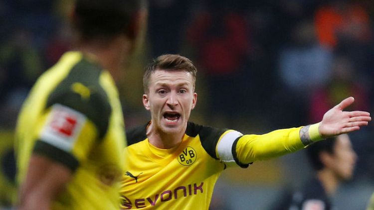 Dortmund draw at Frankfurt but increase lead at top