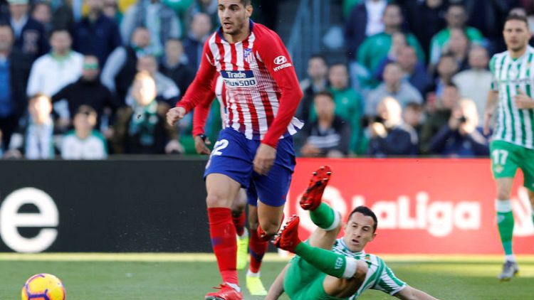 Atletico title bid suffers with defeat at Betis in Morata debut