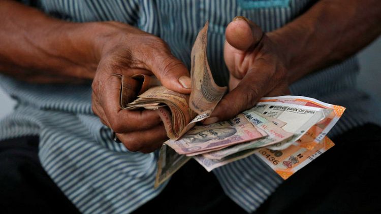 Indian rupee the 'whipping boy', but to dodge record low: Reuters poll
