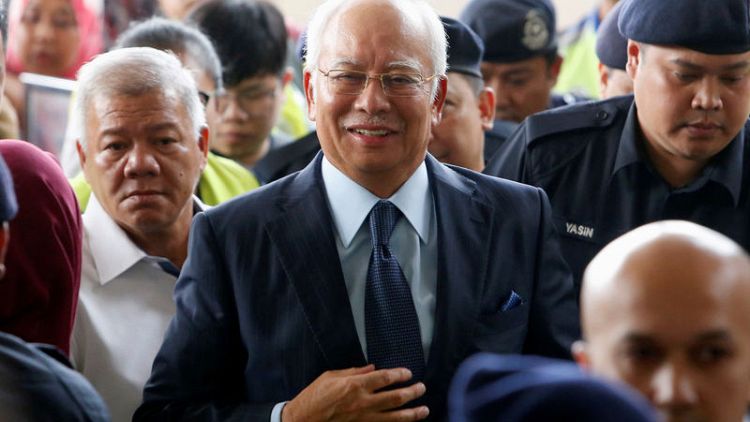 Malaysia's ex-PM Najib gears up for graft trial with charm offensive