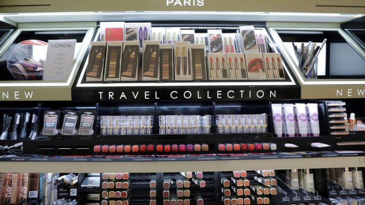 L'Oreal shares edge higher after solid sales and results