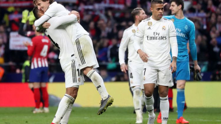 Real back in title fight after Madrid derby victory