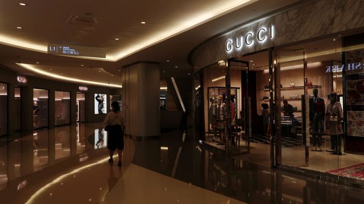 Kering's Gucci joins peers in defying China fears