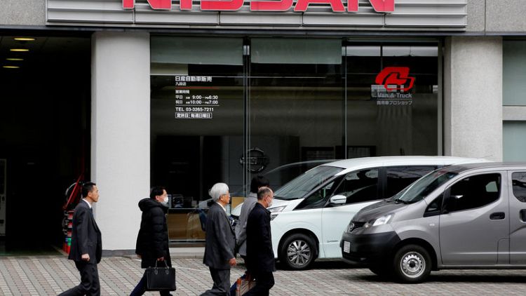 Nissan books $84 million Ghosn-related charges, cuts outlook