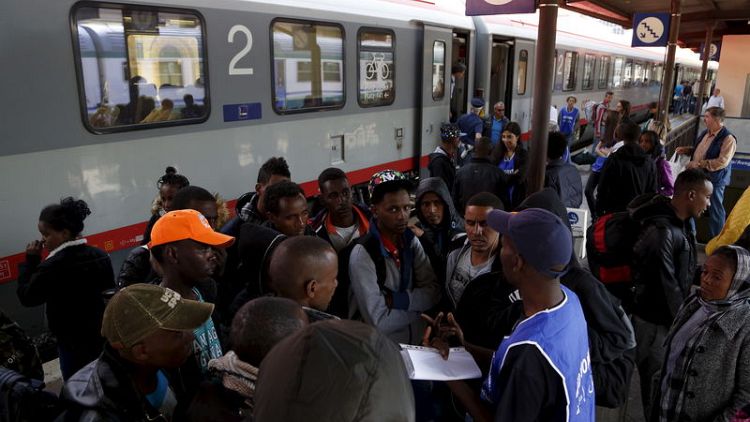 EU asylum applications fall to below half crisis peak