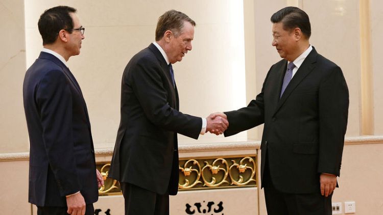 الرئيس الصيني يلتقي بمسؤولي وفد تجاري أمريكي