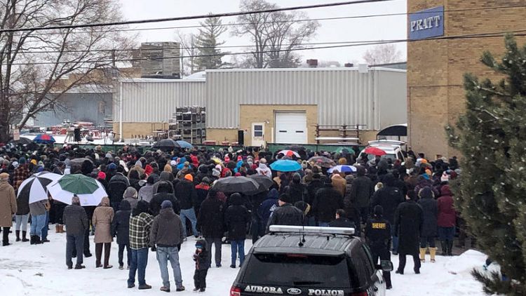 Thousands brave freezing cold in vigil for Illinois shooting victims