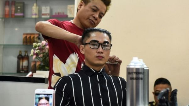 Portraits, coupes de cheveux : la folie Kim-Trump s'empare du Vietnam Portraits, coupes de cheveux : la folie Kim-Trump s'empare du Vietnam