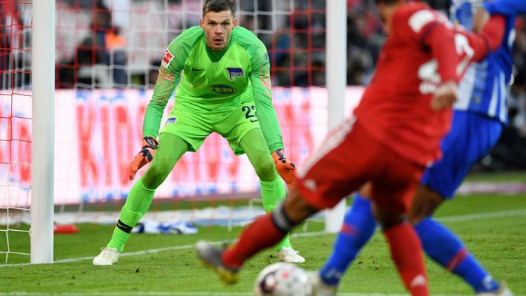 Bayern edge past Hertha to join Dortmund at top