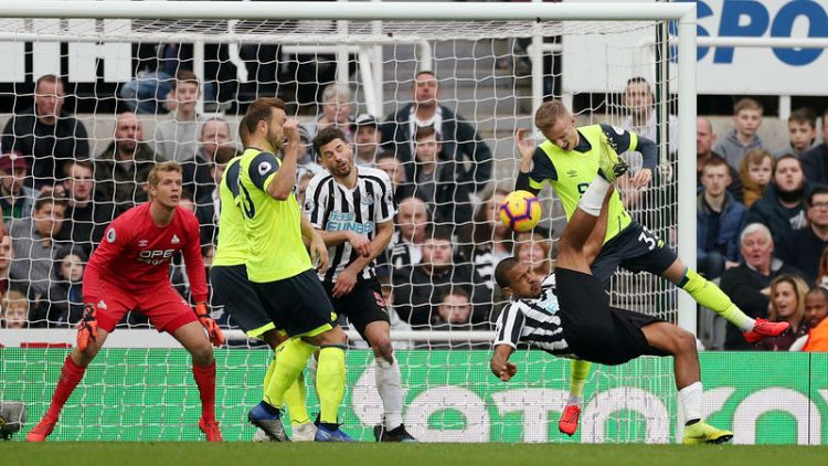 Newcastle plunge 10-man Huddersfield closer to the drop