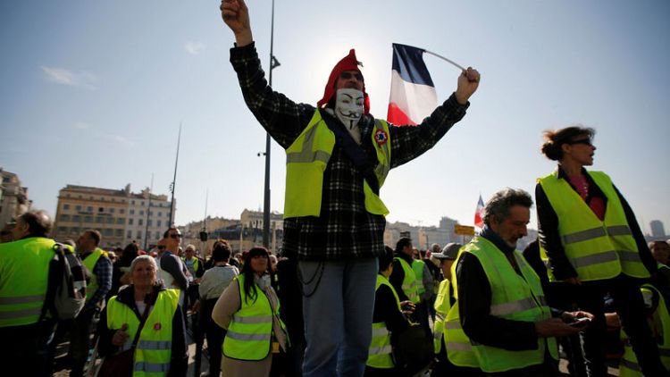 Thousands march as France's 'yellow vest' protests rumble on